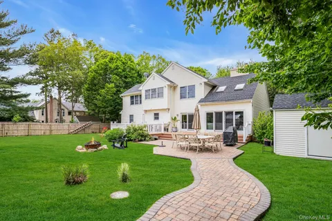 a view of yard with swimming pool and green space