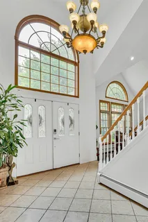 a view of entryway and hall with a front door