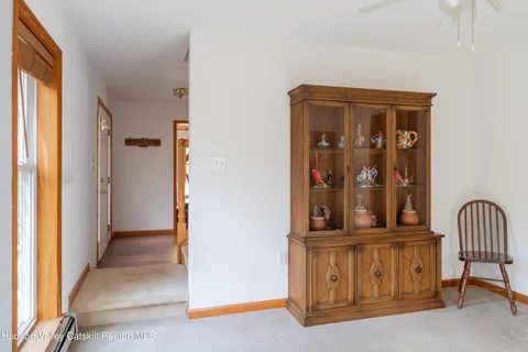 a view of a door with a small yard and furniture