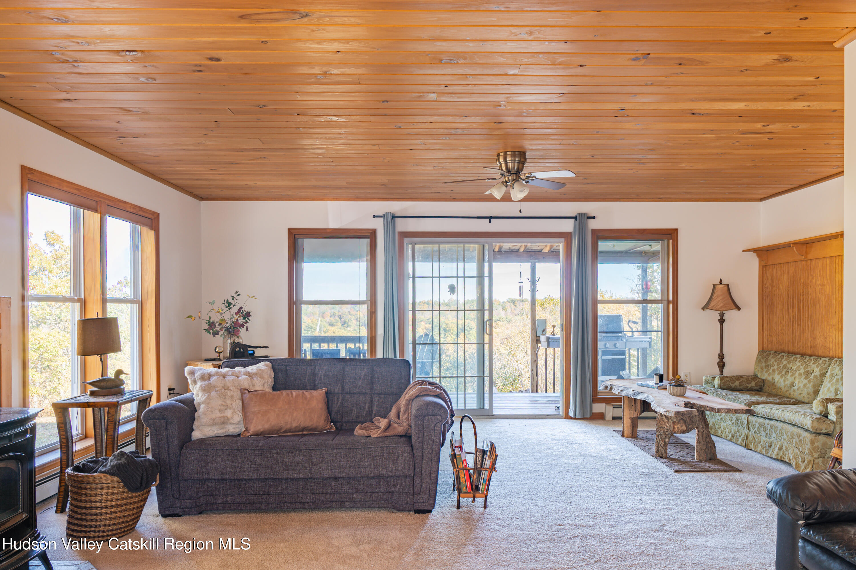 78 Ridge Way Catskill, NY 12414 - Photo 16 of 40 a living room with furniture and floor to ceiling windows