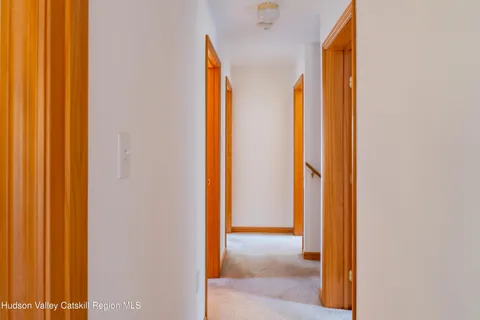 a view of a bathroom from a hallway