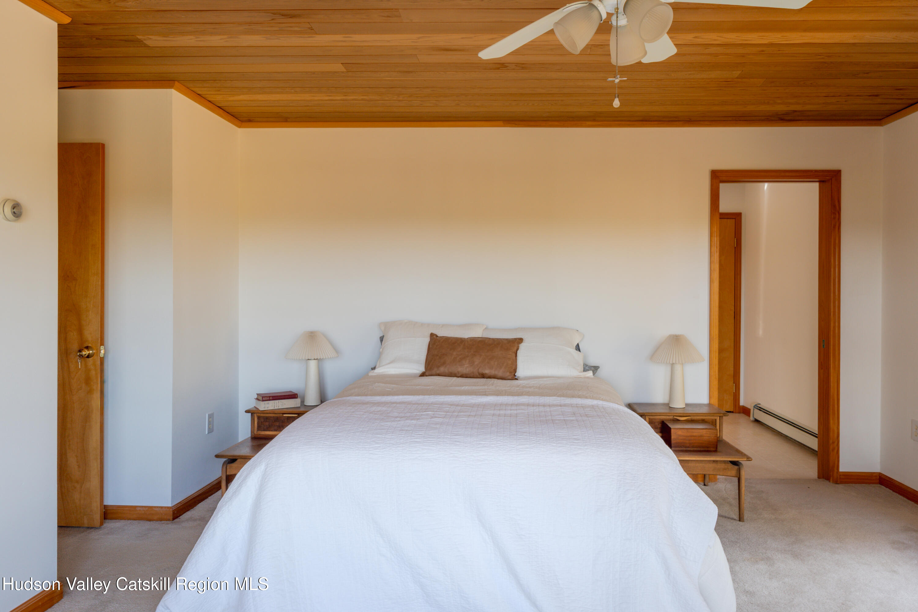 78 Ridge Way Catskill, NY 12414 - Photo 24 of 40 a bedroom with a bed and a night stand