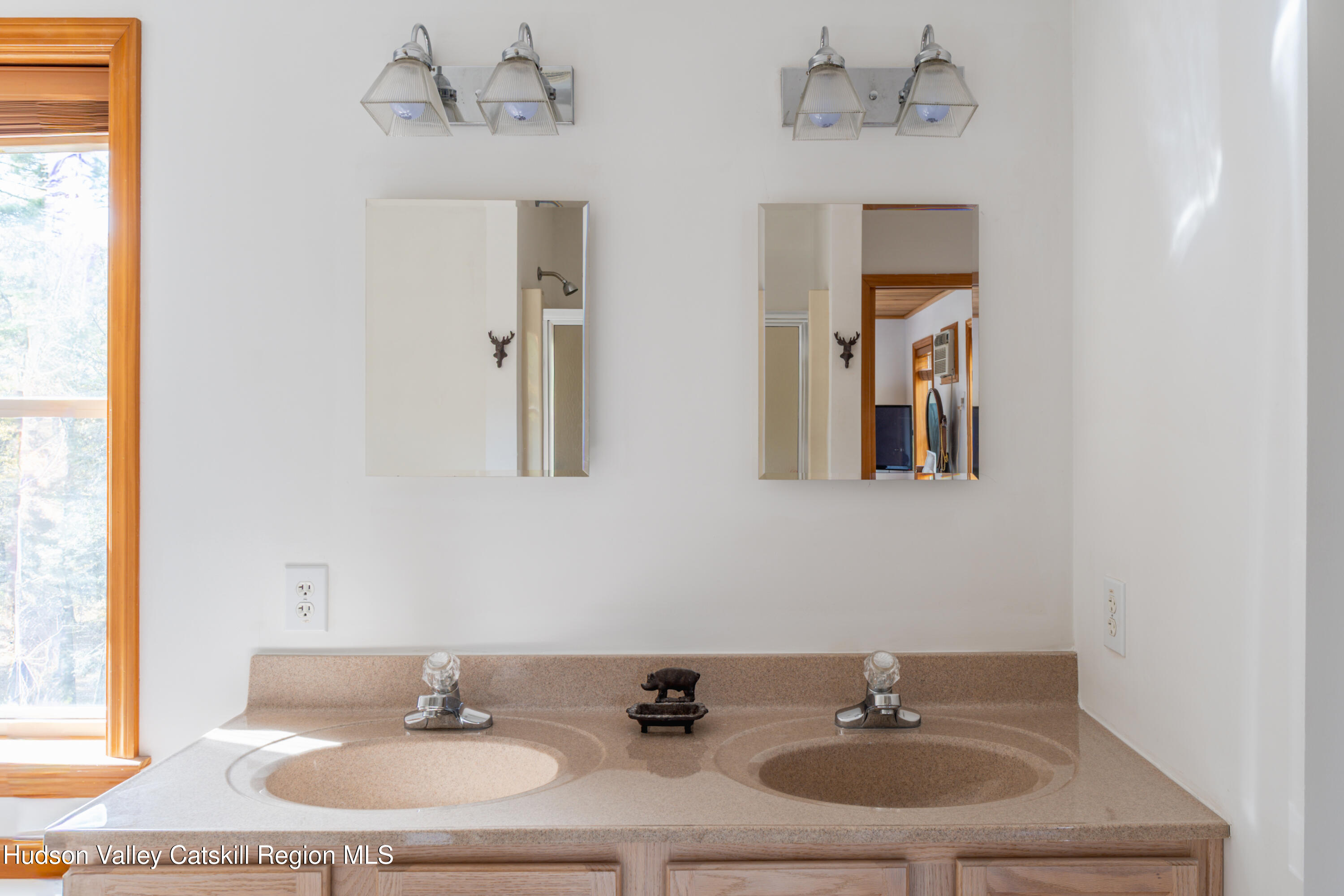 78 Ridge Way Catskill, NY 12414 - Photo 27 of 40 a bathroom with a sink and a mirror