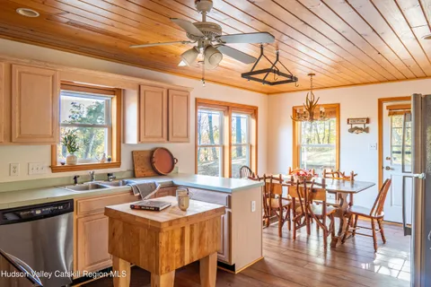 a view of a dining room with furniture window and outside view