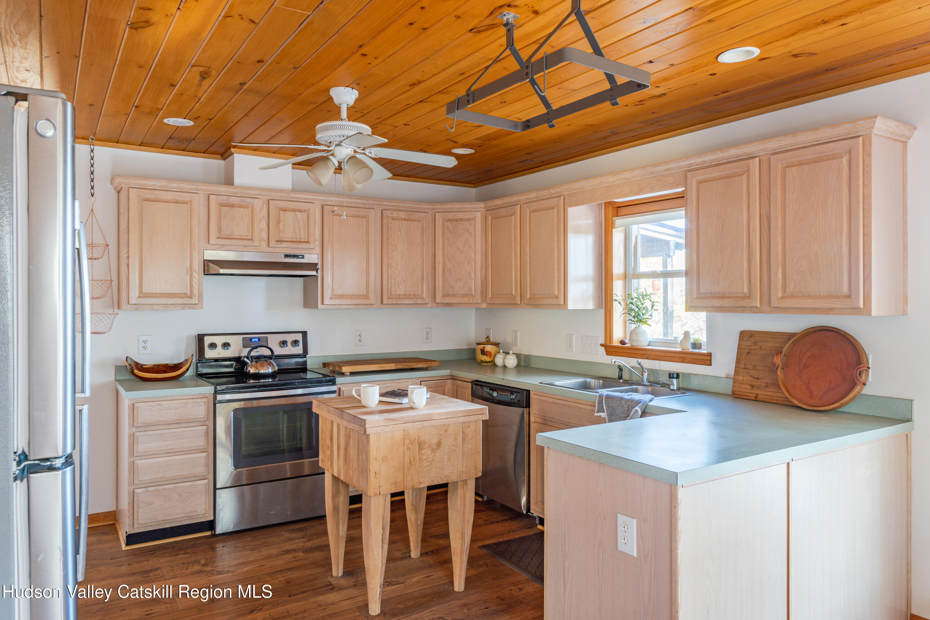 78 Ridge Way Catskill, NY 12414 - Photo 9 of 40 a kitchen with stainless steel appliances granite countertop a stove a sink a refrigerator and white cabinets