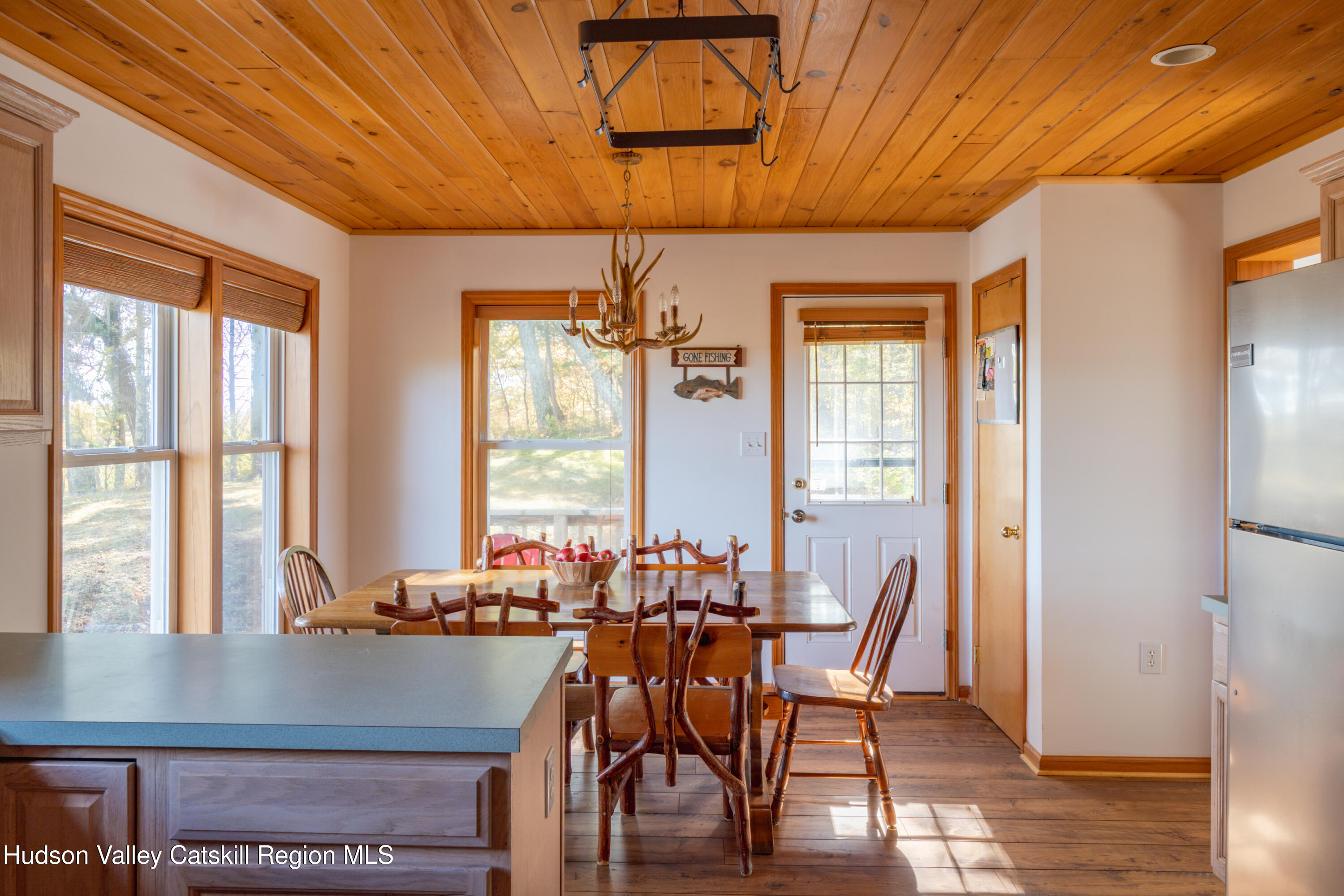 78 Ridge Way Catskill, NY 12414 - Photo 10 of 40 a view of a dining room with furniture window and wooden floor