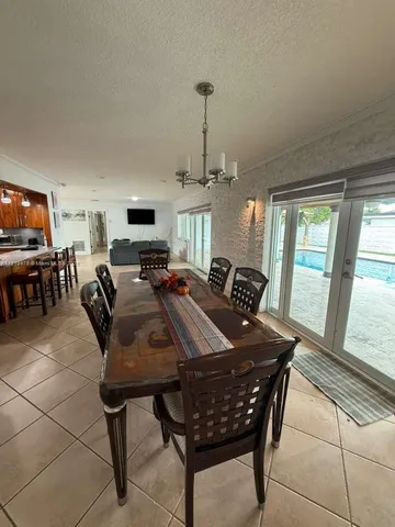 a kitchen with a table and chairs