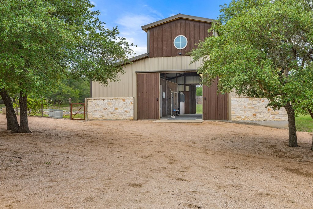 2560 Bell Springs Road Dripping Springs, TX 78620 - Photo 30 of 40 a view of a house with a outdoor space