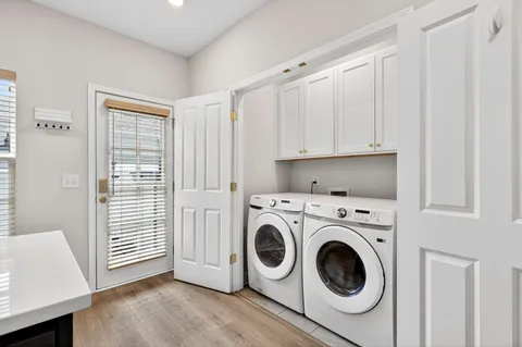 a view of a kitchen with washer and dryer