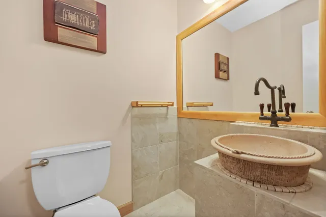 a bathroom with a toilet and a sink