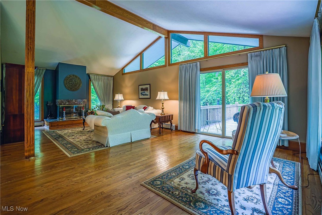 875 North Medina Line Road Akron, OH 44333 - Photo 6 of 32 Wood-Burning Fireplace and upper deck off the sliders