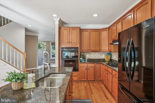 a view of a room with wooden floor and staircase