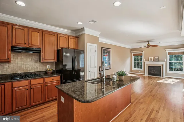 wooden floor in an empty room with a fireplace