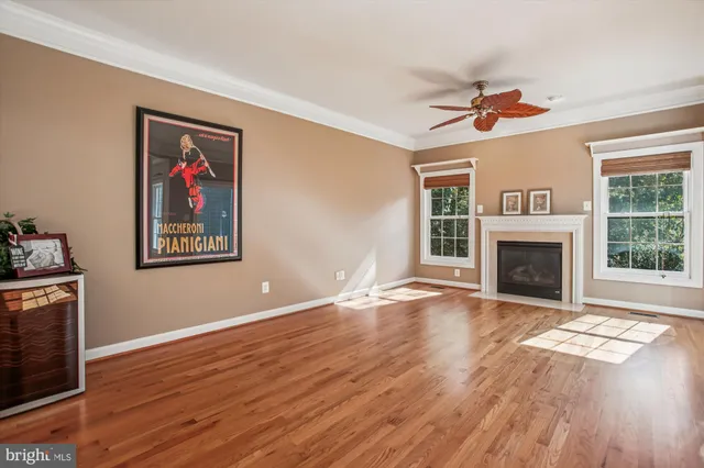 a view of a balcony with a floor to ceiling window next to a yard