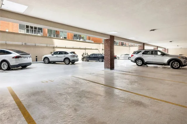 a view of a patio with couple of chairs and tables