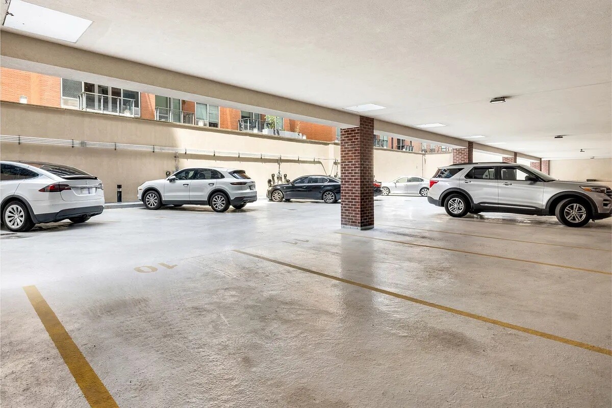 41-26 27th Street, Unit 3D Queens, NY 11101 - Photo 19 of 29 a view of parking space with cars parked
