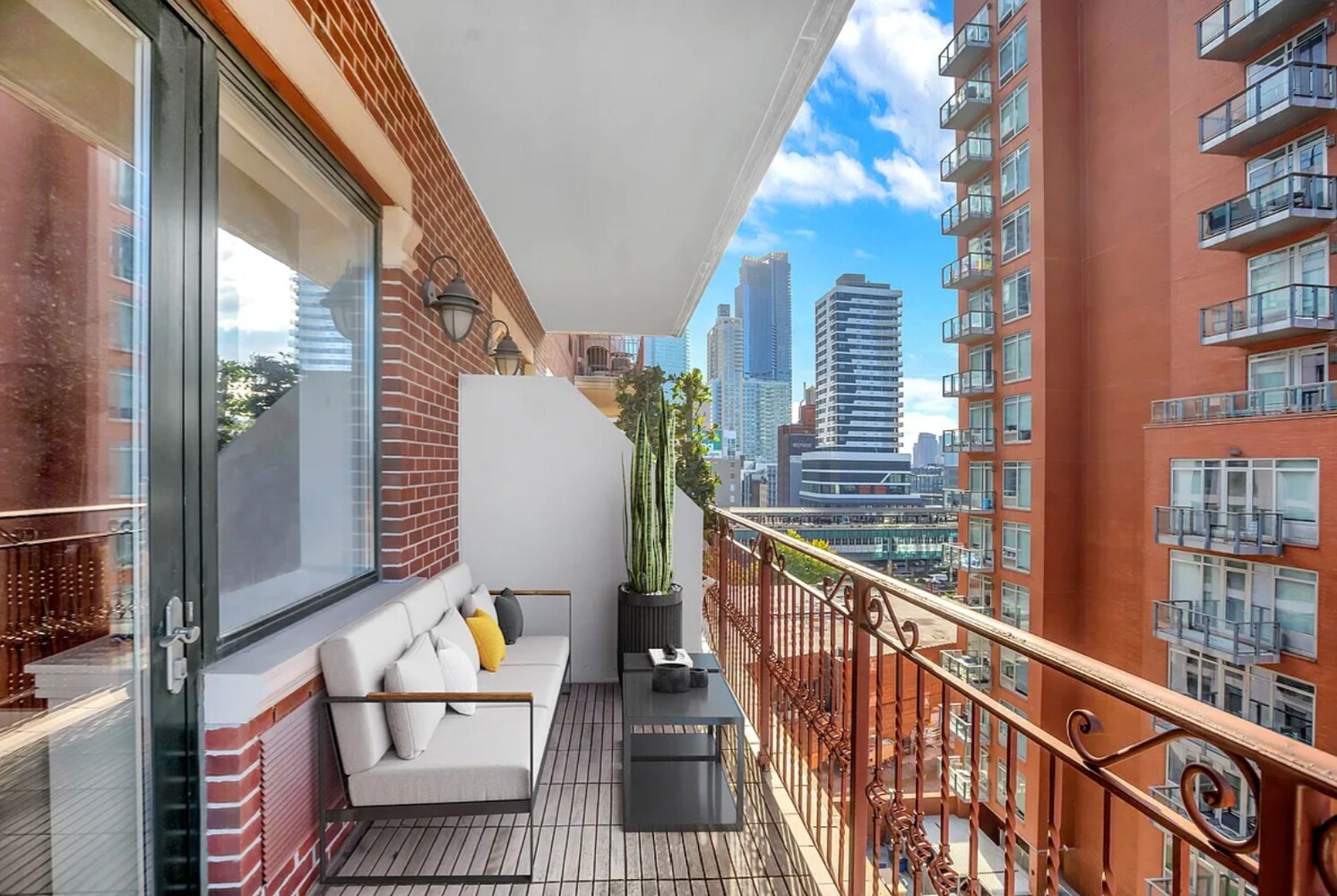 41-26 27th Street, Unit 3D Queens, NY 11101 - Photo 2 of 29 a view of a balcony with furniture