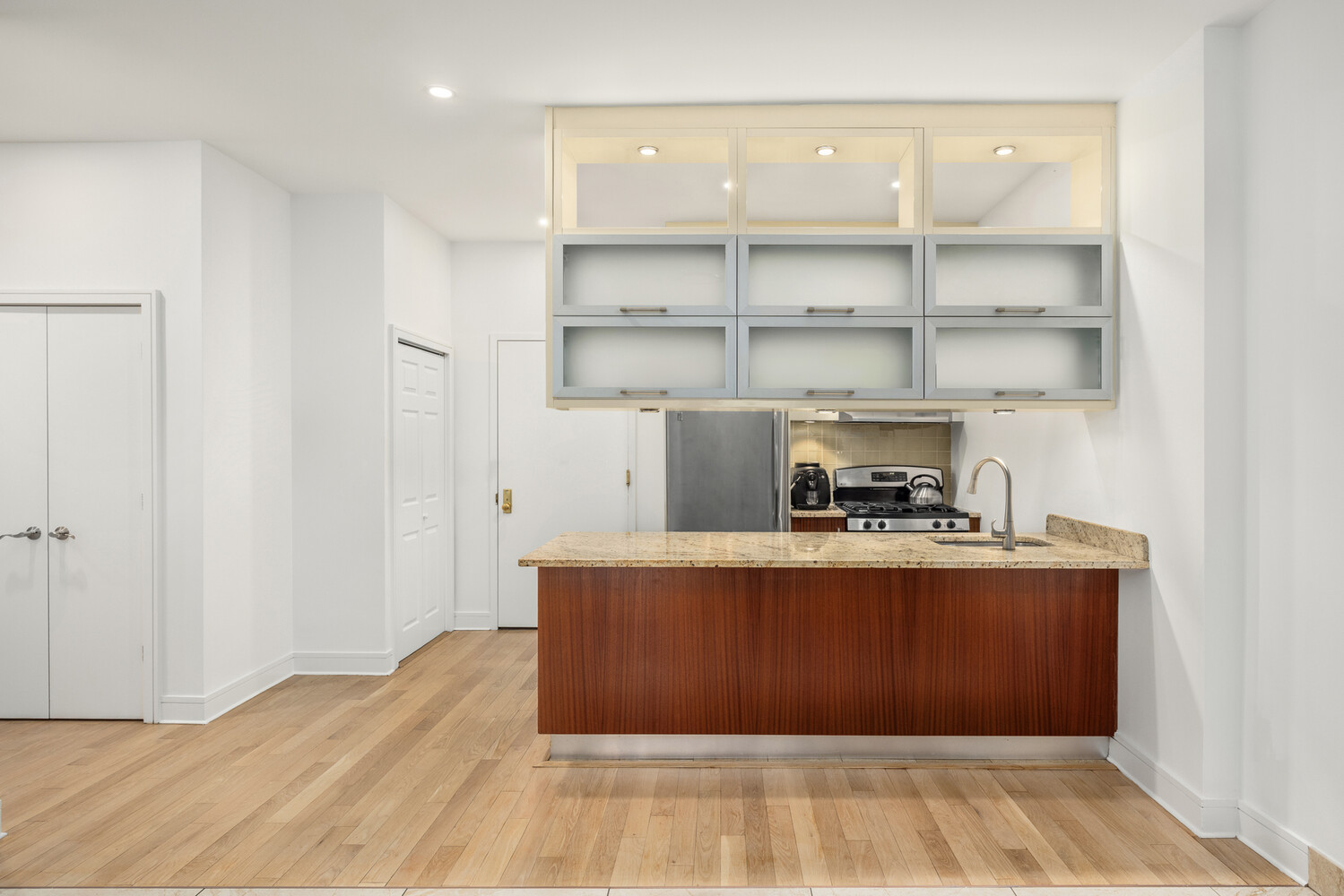 41-26 27th Street, Unit 3D Queens, NY 11101 - Photo 4 of 29 a view of kitchen island with wooden floor