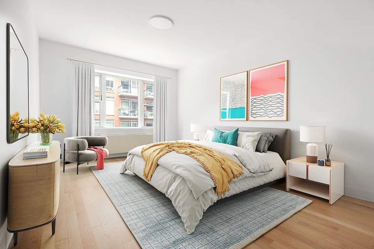 41-26 27th Street, Unit 3D Queens, NY 11101 - Photo 6 of 29 a bedroom with a bed couch and window