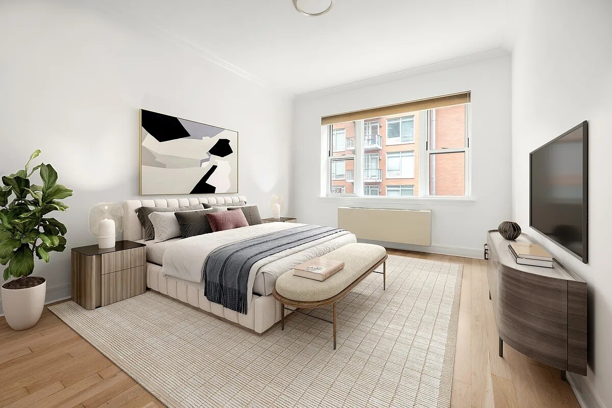 41-26 27th Street, Unit 3D Queens, NY 11101 - Photo 7 of 29 a bedroom with bed table and flat screen tv