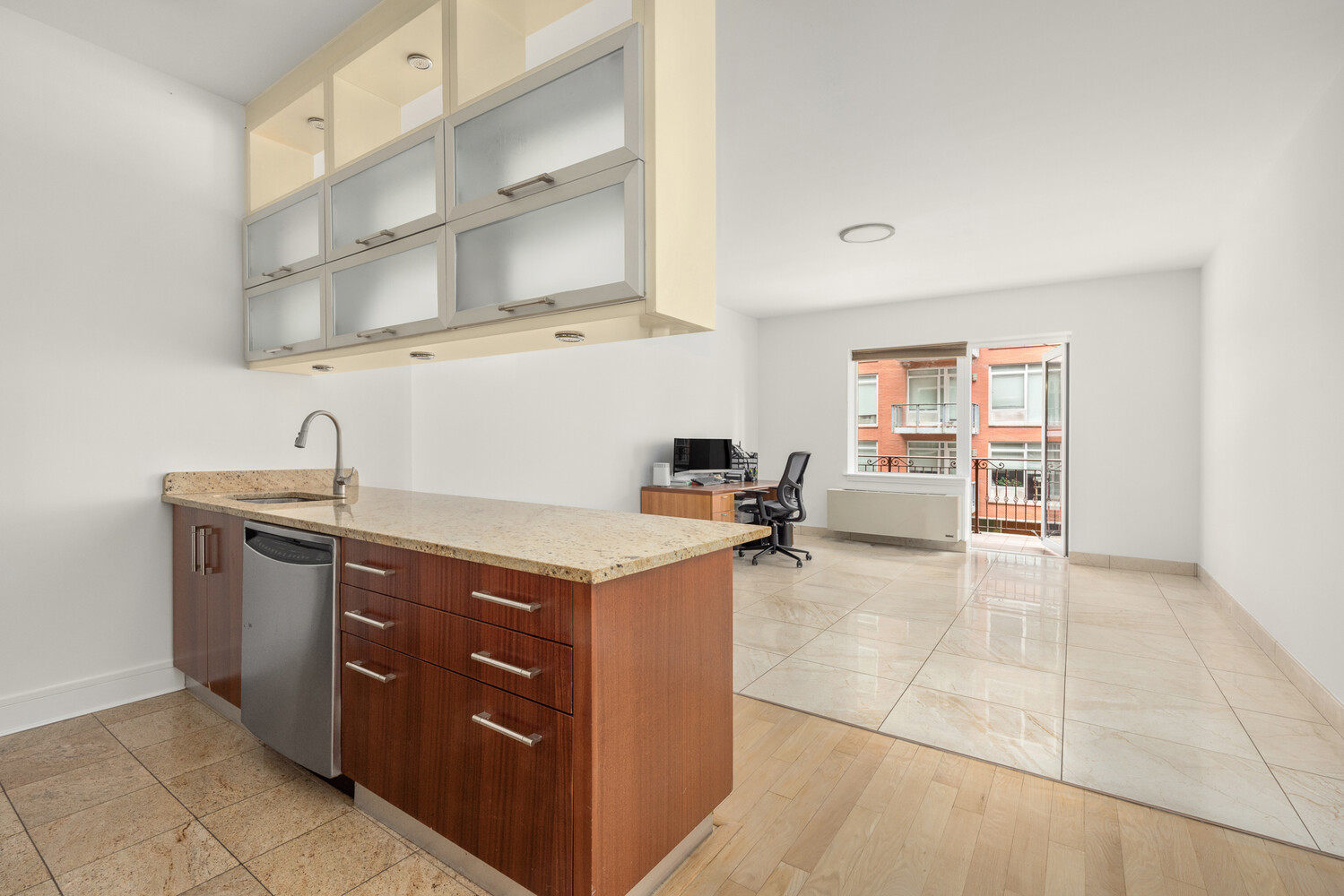41-26 27th Street, Unit 3D Queens, NY 11101 - Photo 8 of 29 a kitchen with stainless steel appliances granite countertop a sink and cabinets