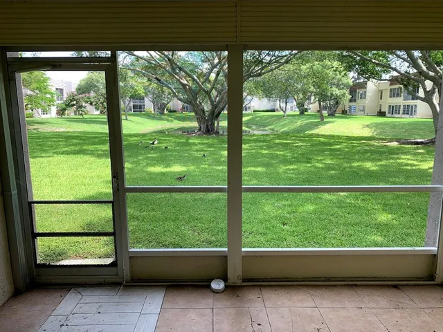 a view of backyard with green space
