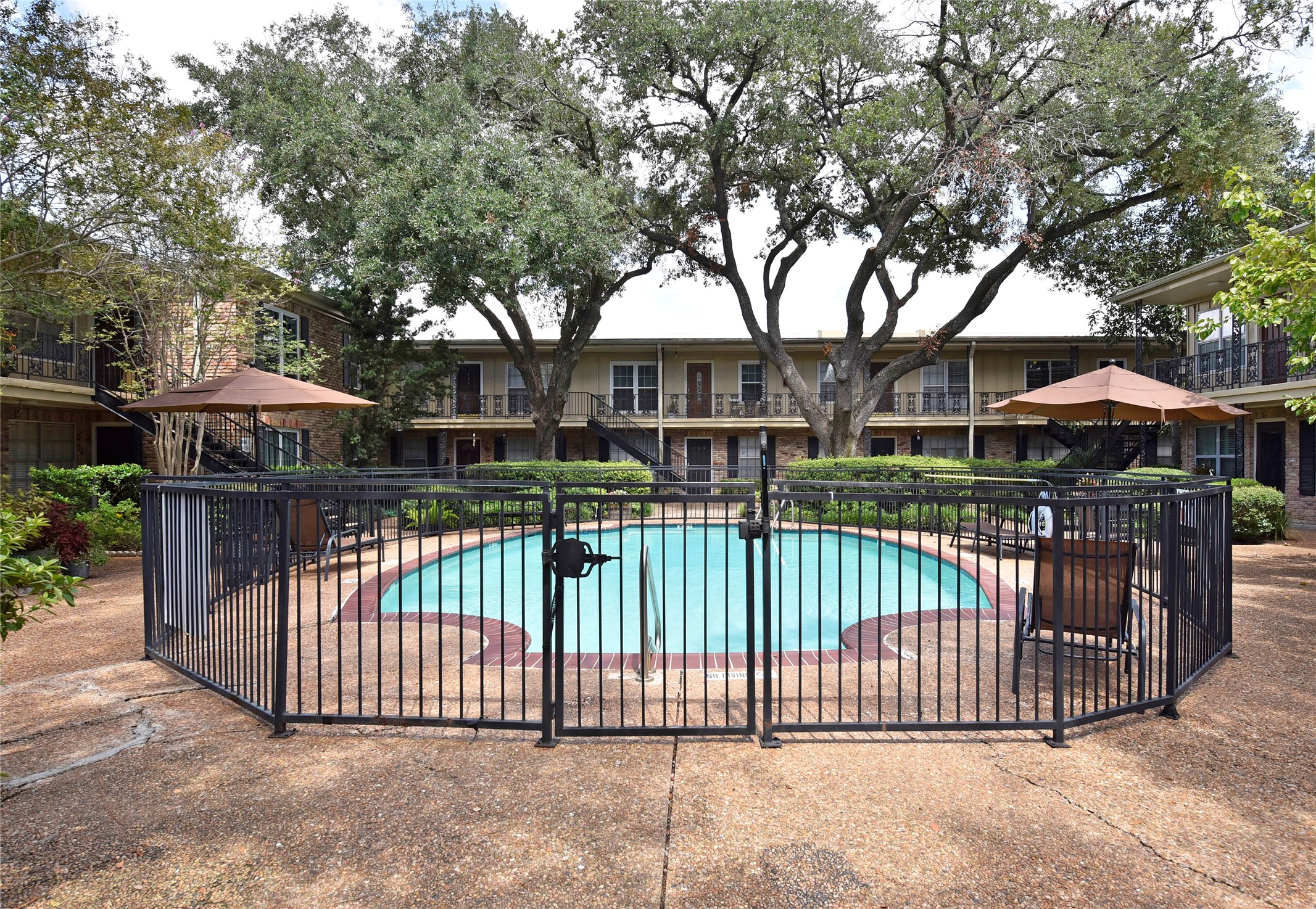 3224 Timmons Lane, Unit 112 Houston, TX 77027 - Photo 24 of 30 a view of a wrought iron fences in front of house