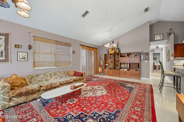 a living room with a couch and a rug