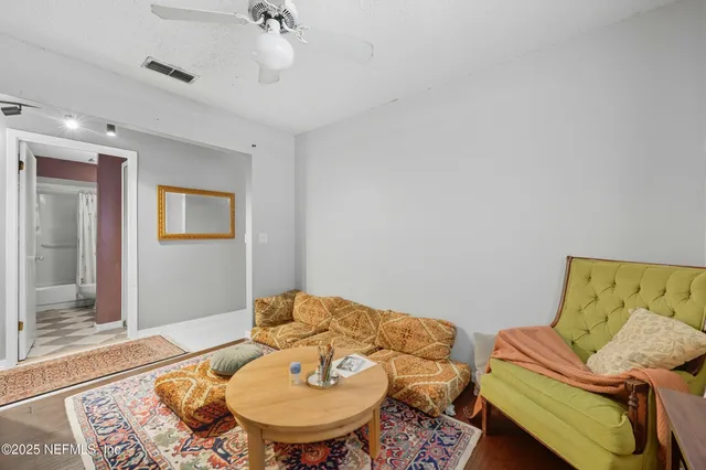 a living room with furniture and a table