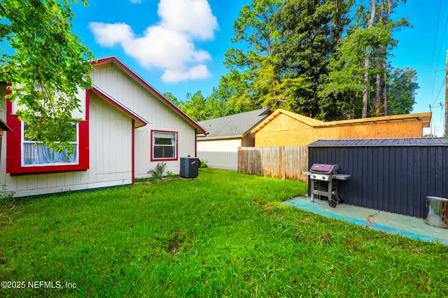 a backyard of a house with seating space