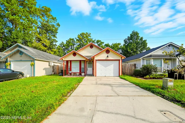 a front view of a house with yard