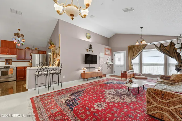 a living room with furniture fireplace and flat screen tv