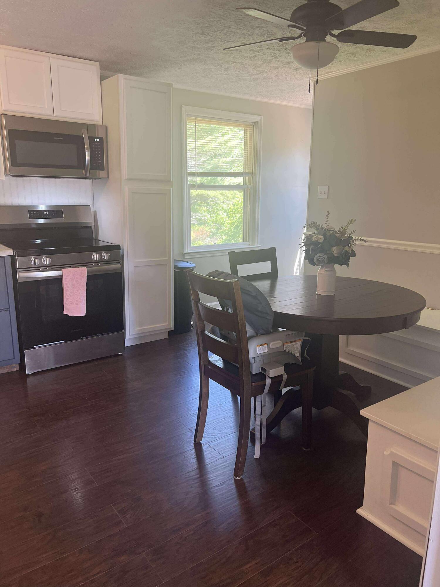 360 Rakes Road Rocky Mount, VA 24151 - Photo 4 of 32 a view of a dining room with furniture window and wooden floor