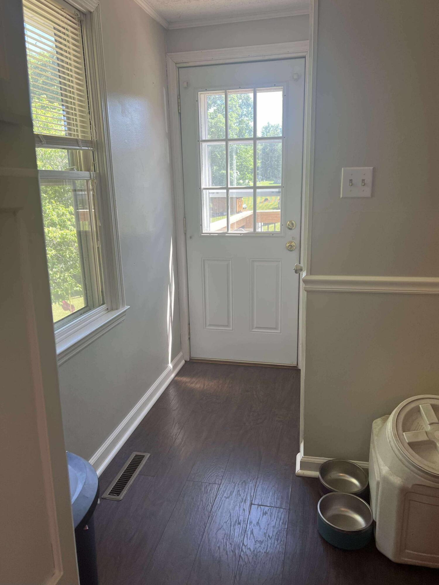 360 Rakes Road Rocky Mount, VA 24151 - Photo 9 of 32 a view of a room with wooden floor and windows