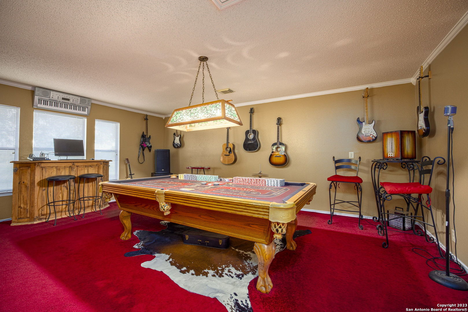 1940 Lower Seguin Road Marion, TX 78124 - Photo 28 of 49 a bedroom with a bed and a chandelier