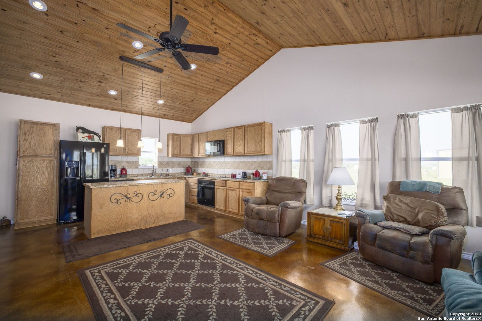 1940 Lower Seguin Road Marion, TX 78124 - Photo 32 of 49 a living room with furniture kitchen view and a large window