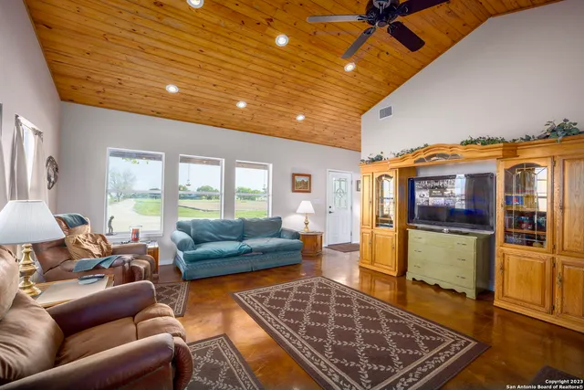 a living room with furniture and a rug