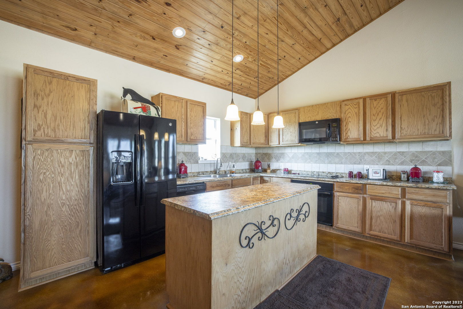 1940 Lower Seguin Road Marion, TX 78124 - Photo 34 of 49 a kitchen with stainless steel appliances granite countertop a sink stove and refrigerator
