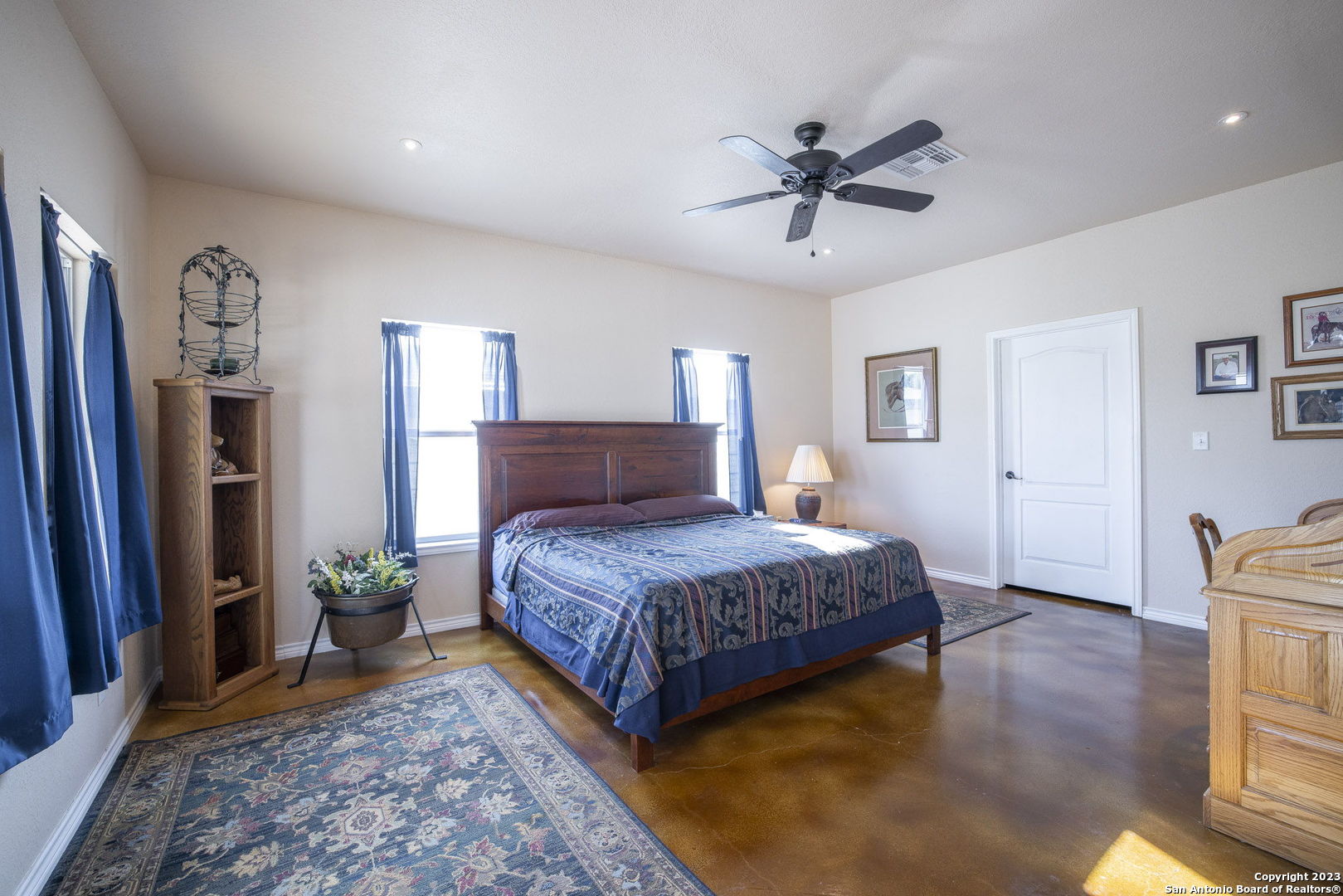 1940 Lower Seguin Road Marion, TX 78124 - Photo 36 of 49 a bedroom with a bed and a chandelier