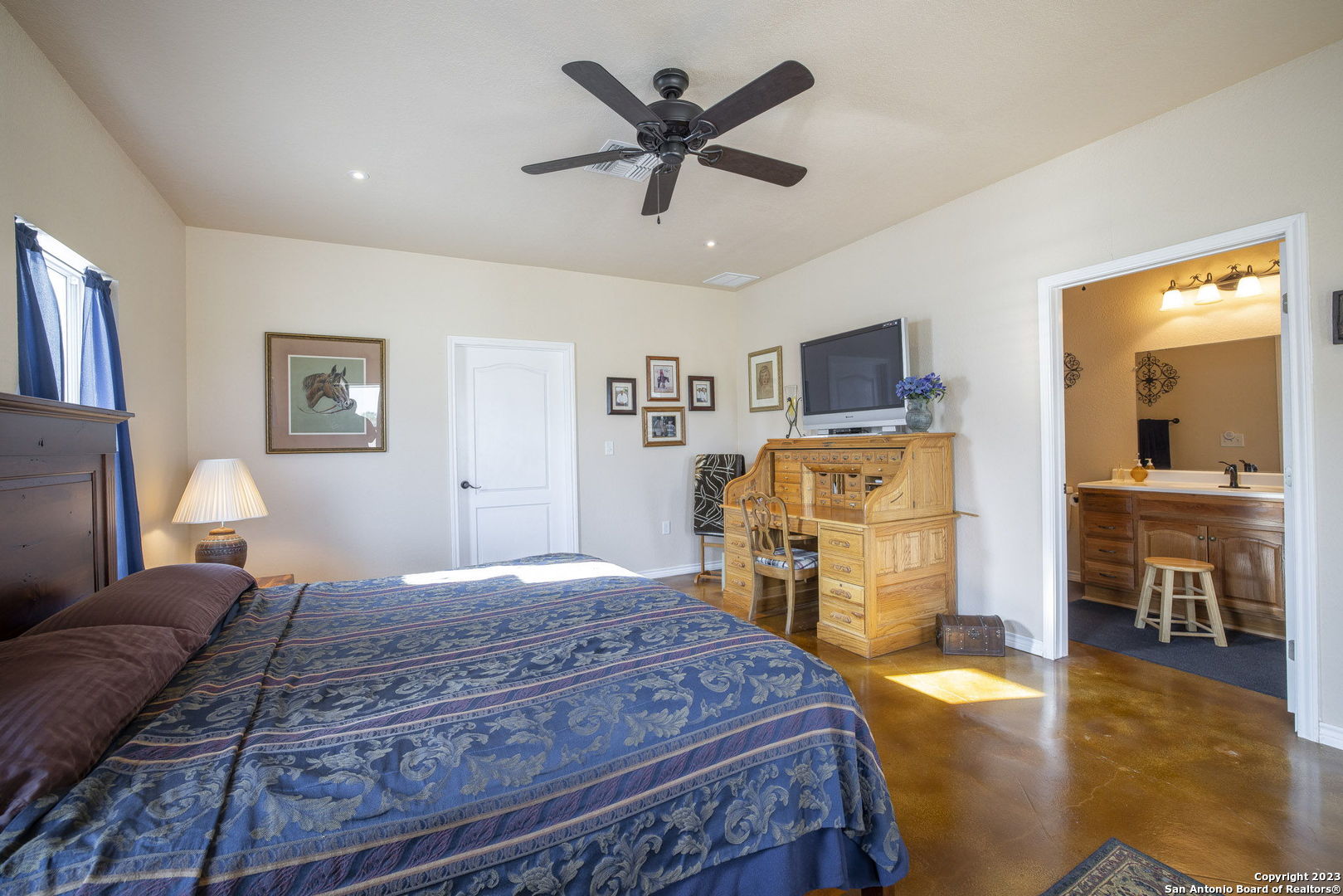1940 Lower Seguin Road Marion, TX 78124 - Photo 37 of 49 a bedroom with a bed and wooden floor