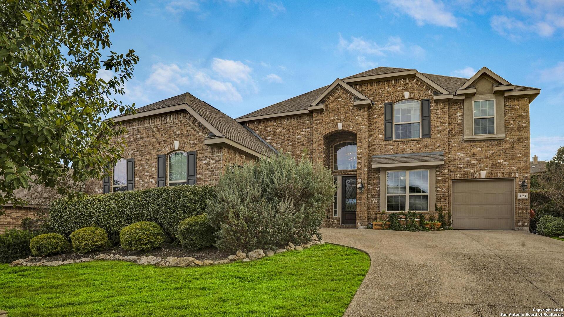 3754 Tumeric Cove Bulverde, TX 78163 - Photo 1 of 42 a front view of a house with a yard