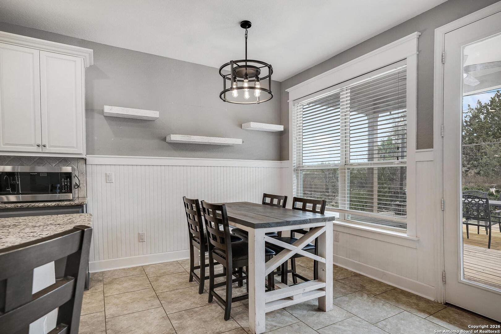 3754 Tumeric Cove Bulverde, TX 78163 - Photo 18 of 42 a dining room with furniture and window