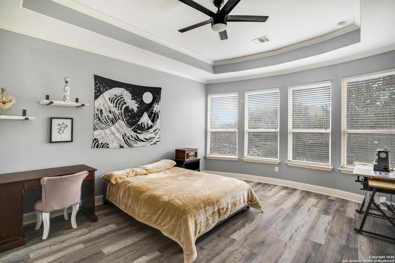 3754 Tumeric Cove Bulverde, TX 78163 - Photo 19 of 42 a bedroom with a large bed and a window