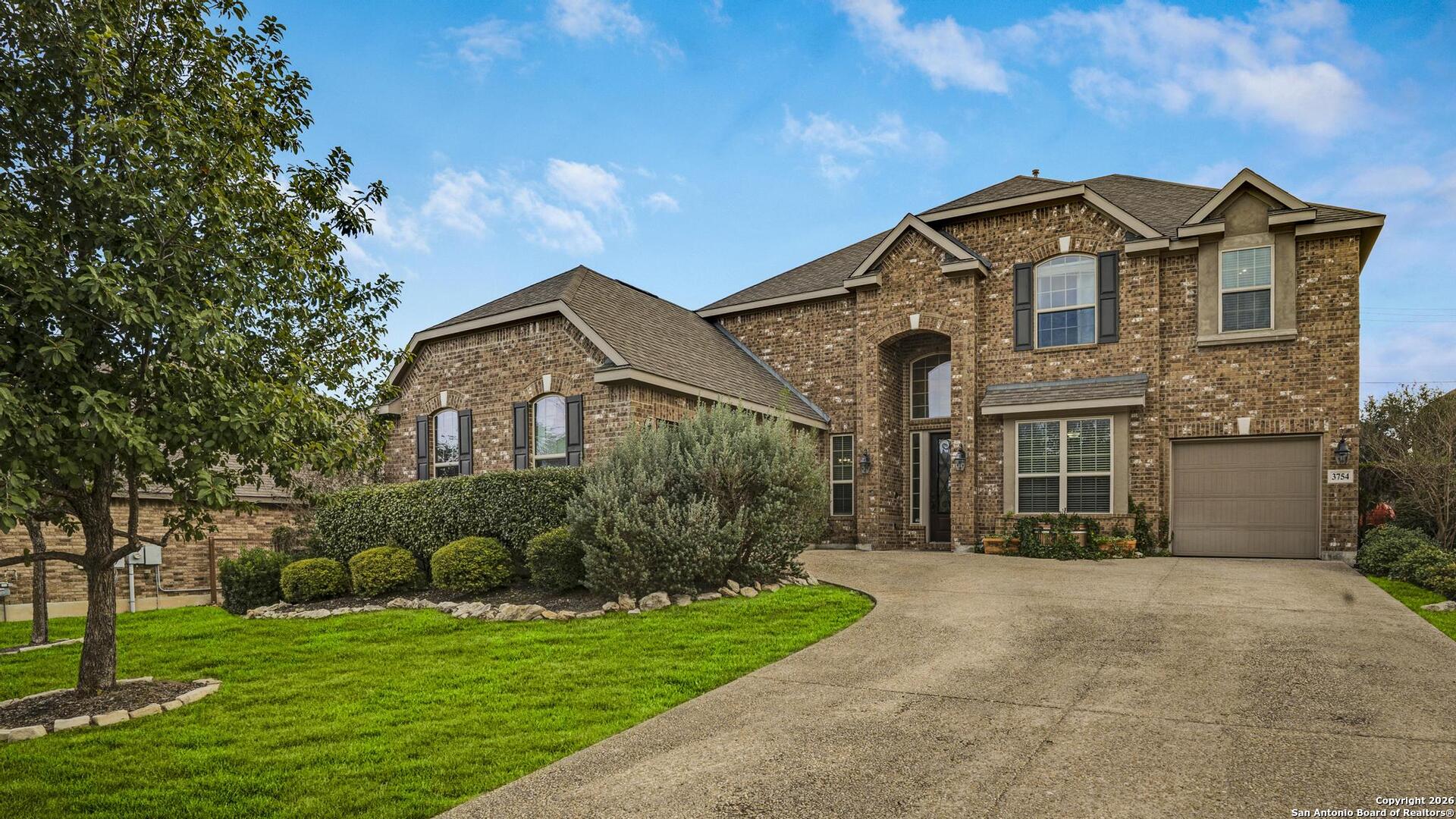 3754 Tumeric Cove Bulverde, TX 78163 - Photo 2 of 42 a front view of a house with a yard
