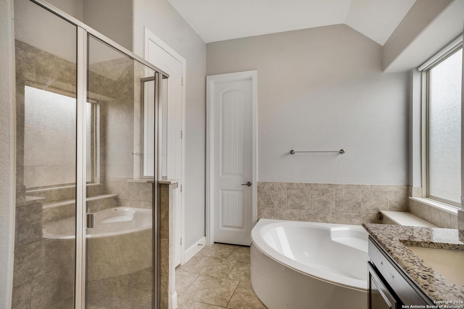 3754 Tumeric Cove Bulverde, TX 78163 - Photo 22 of 42 a bathroom with a sink and a bathtub