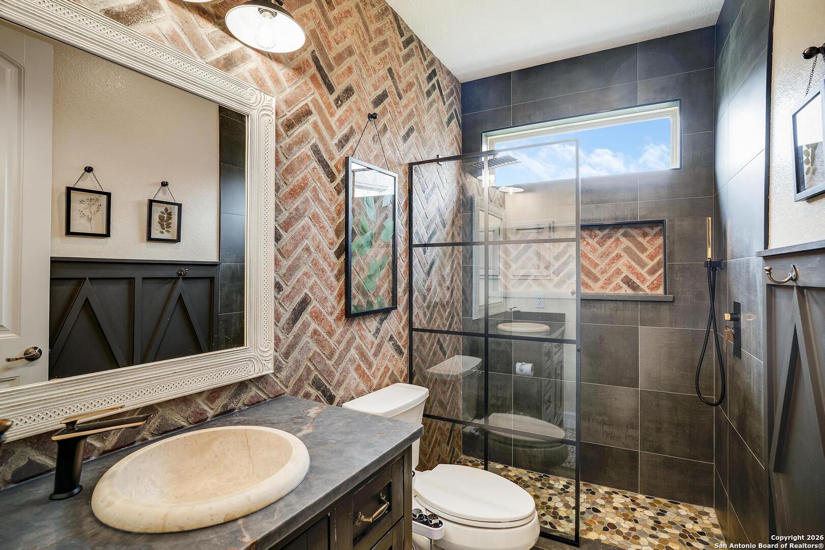 3754 Tumeric Cove Bulverde, TX 78163 - Photo 24 of 42 a bathroom with a sink a toilet and shower