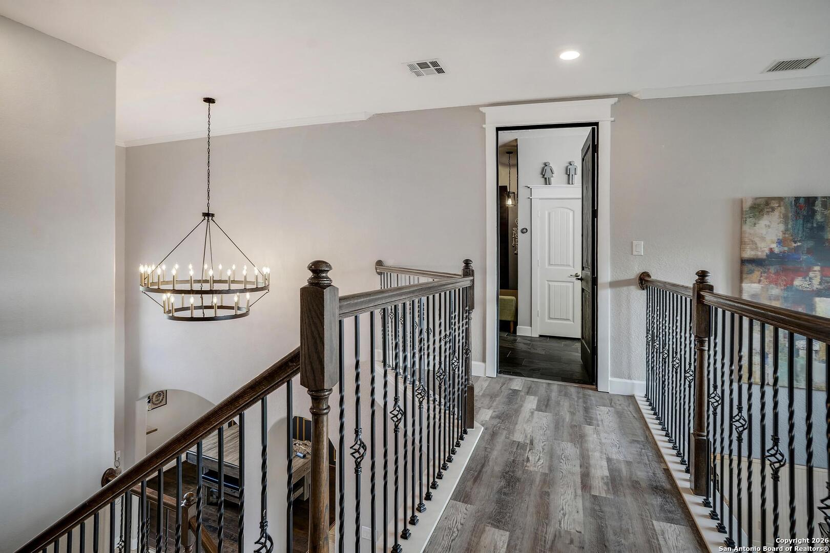 3754 Tumeric Cove Bulverde, TX 78163 - Photo 25 of 42 a view of a hallway with wooden floor