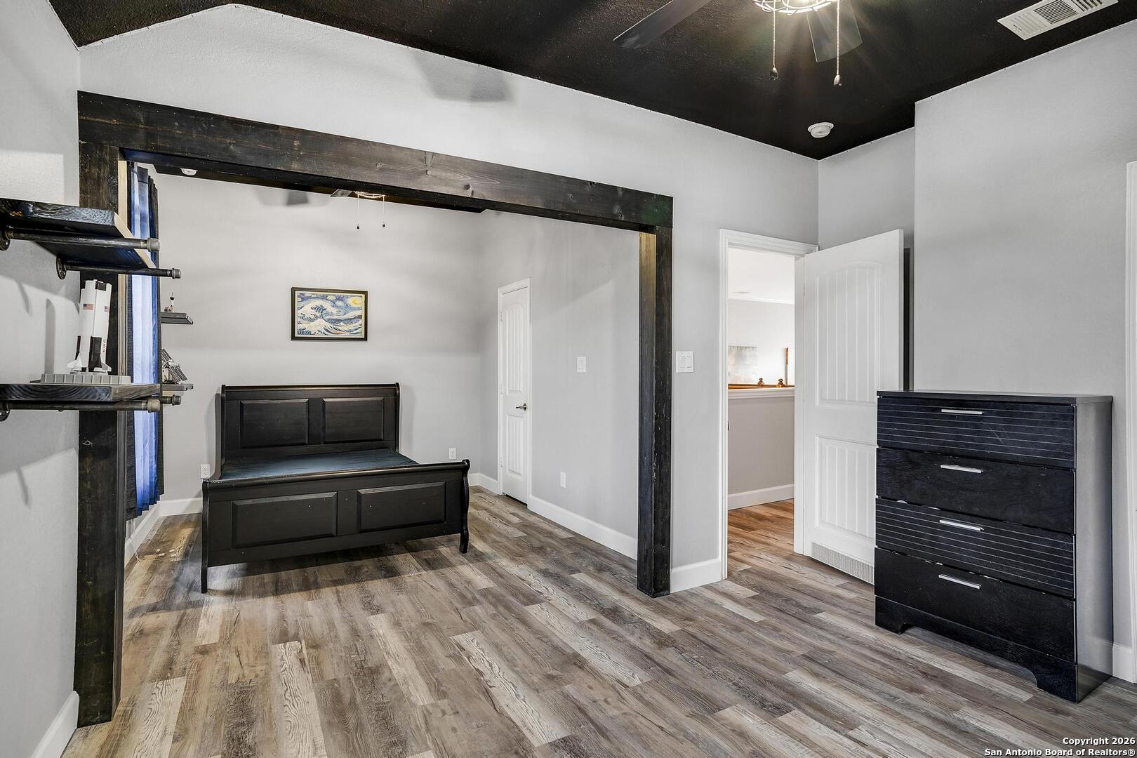 3754 Tumeric Cove Bulverde, TX 78163 - Photo 36 of 42 a living room with a bed and furniture