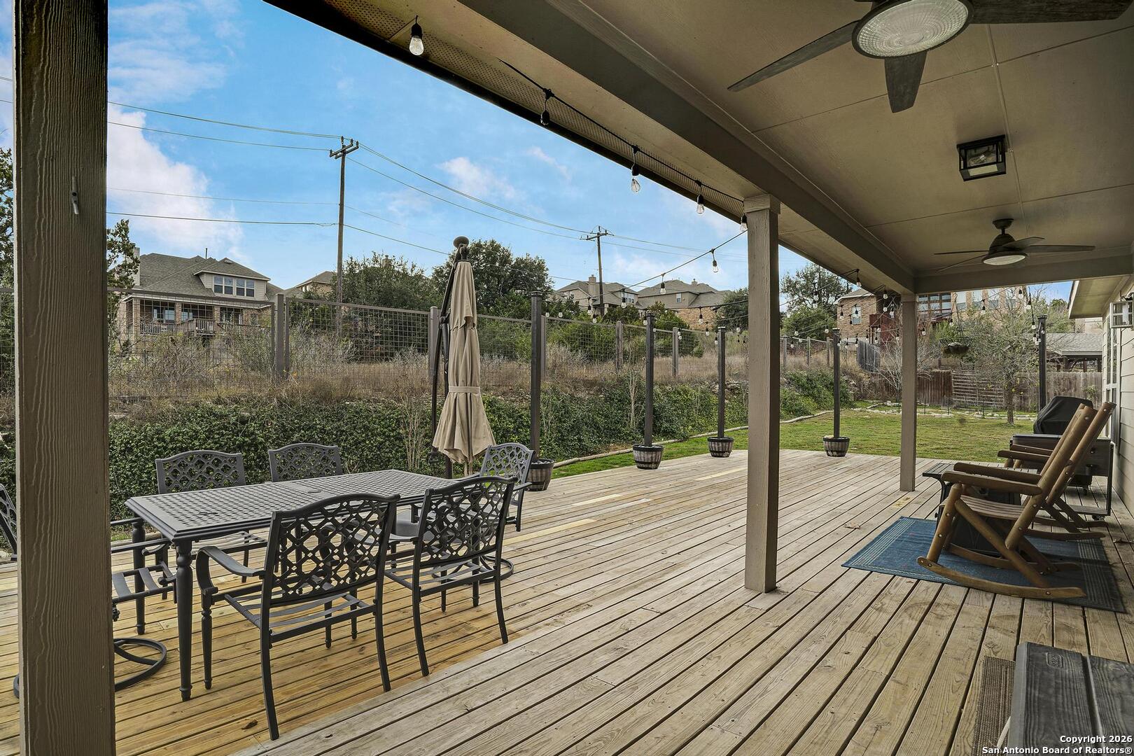 3754 Tumeric Cove Bulverde, TX 78163 - Photo 37 of 42 a view of a roof deck with table and chairs