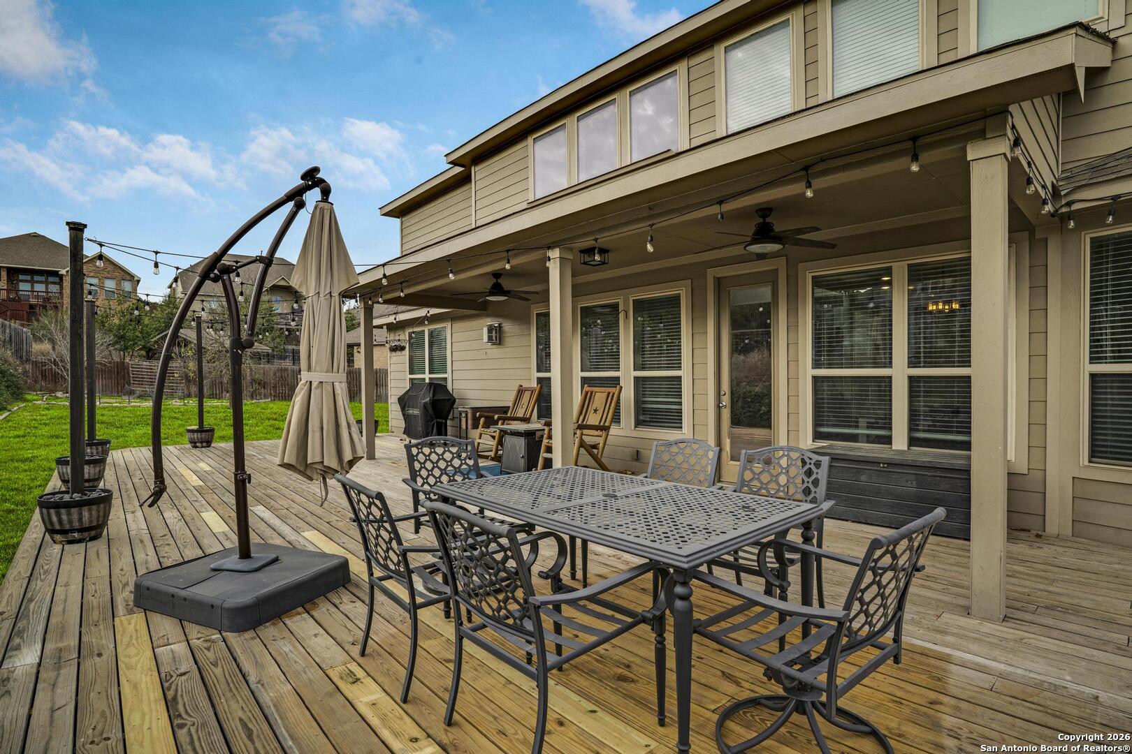 3754 Tumeric Cove Bulverde, TX 78163 - Photo 39 of 42 a view of a dinning table and chairs in patio of the house